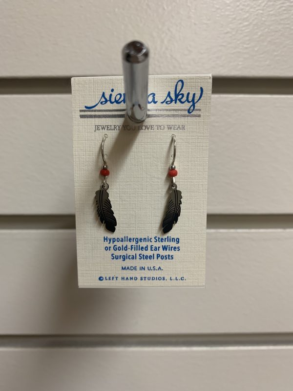 earrings in the shape of feathers